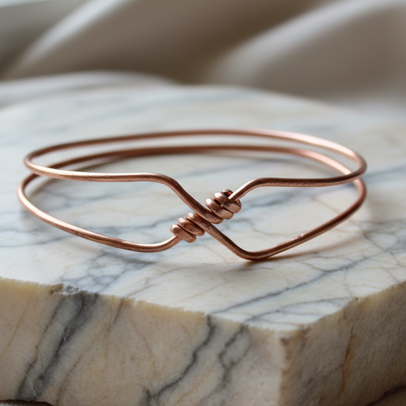 Copper bangle on chunky rough marble