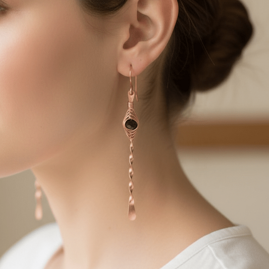 woman wearing copper herringbone twist handmade earrings carrie foscato design USA