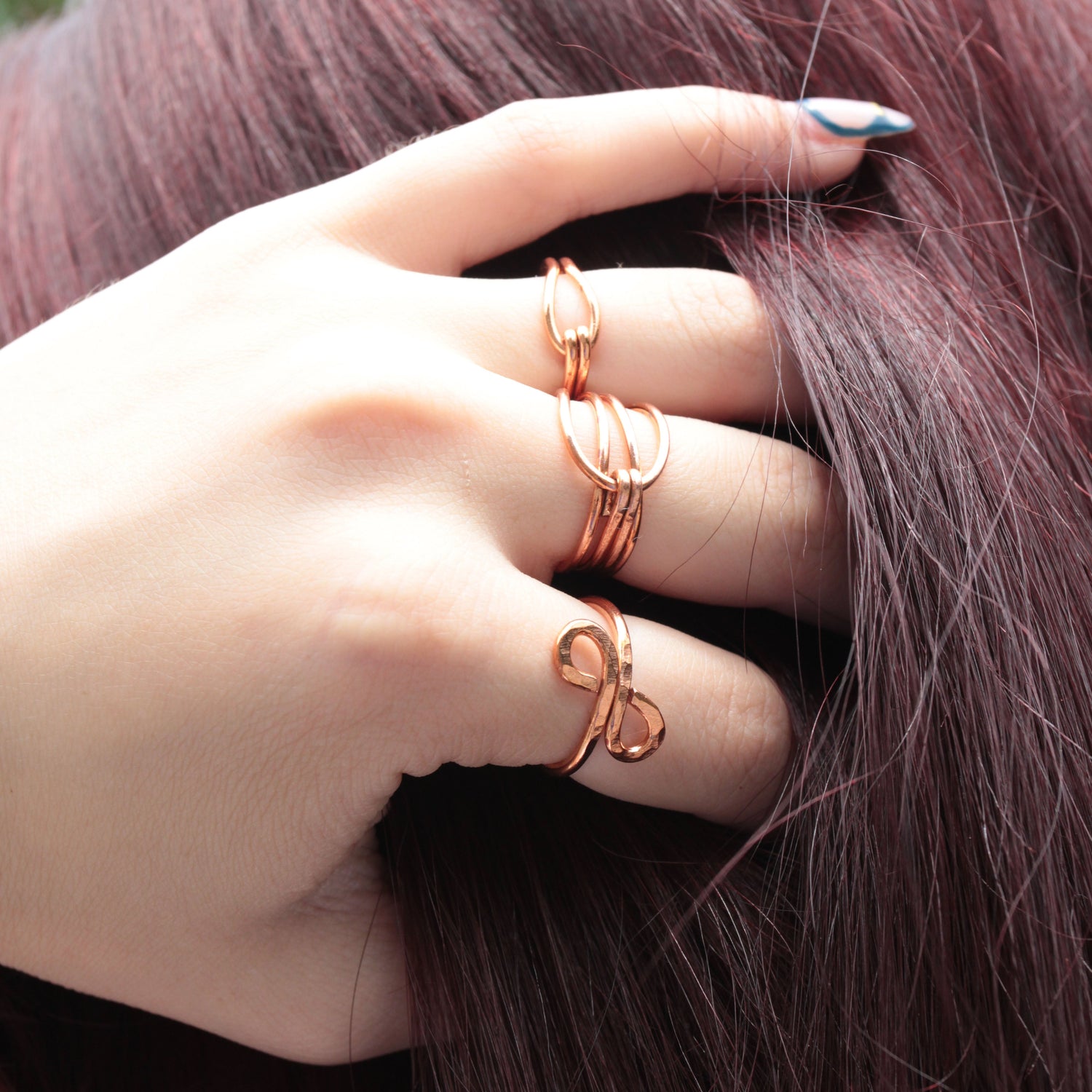 handmade wire wrapped rings in copper and sterling silver