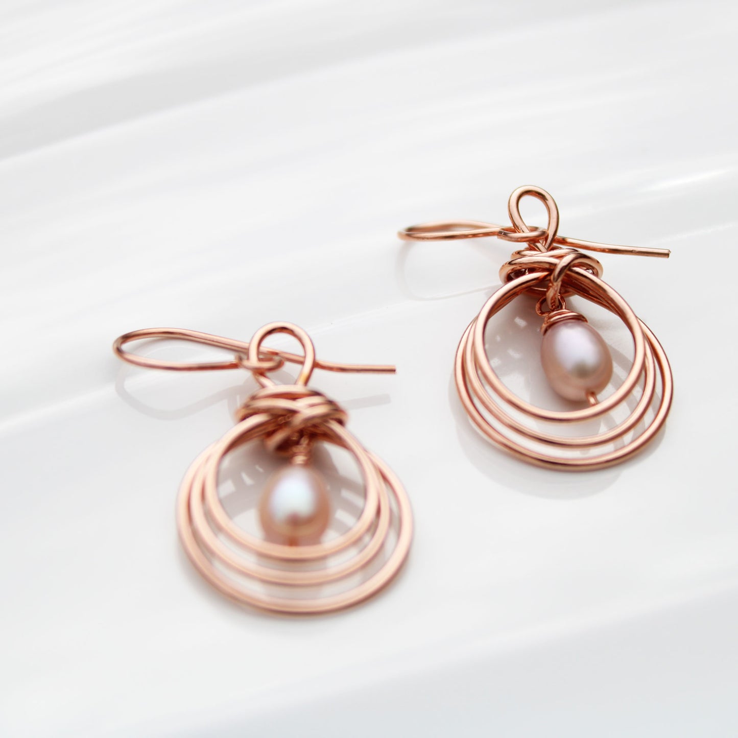pipa knot wire wrapped copper earrings with pearl teardrop handmade USA carrie foscato design