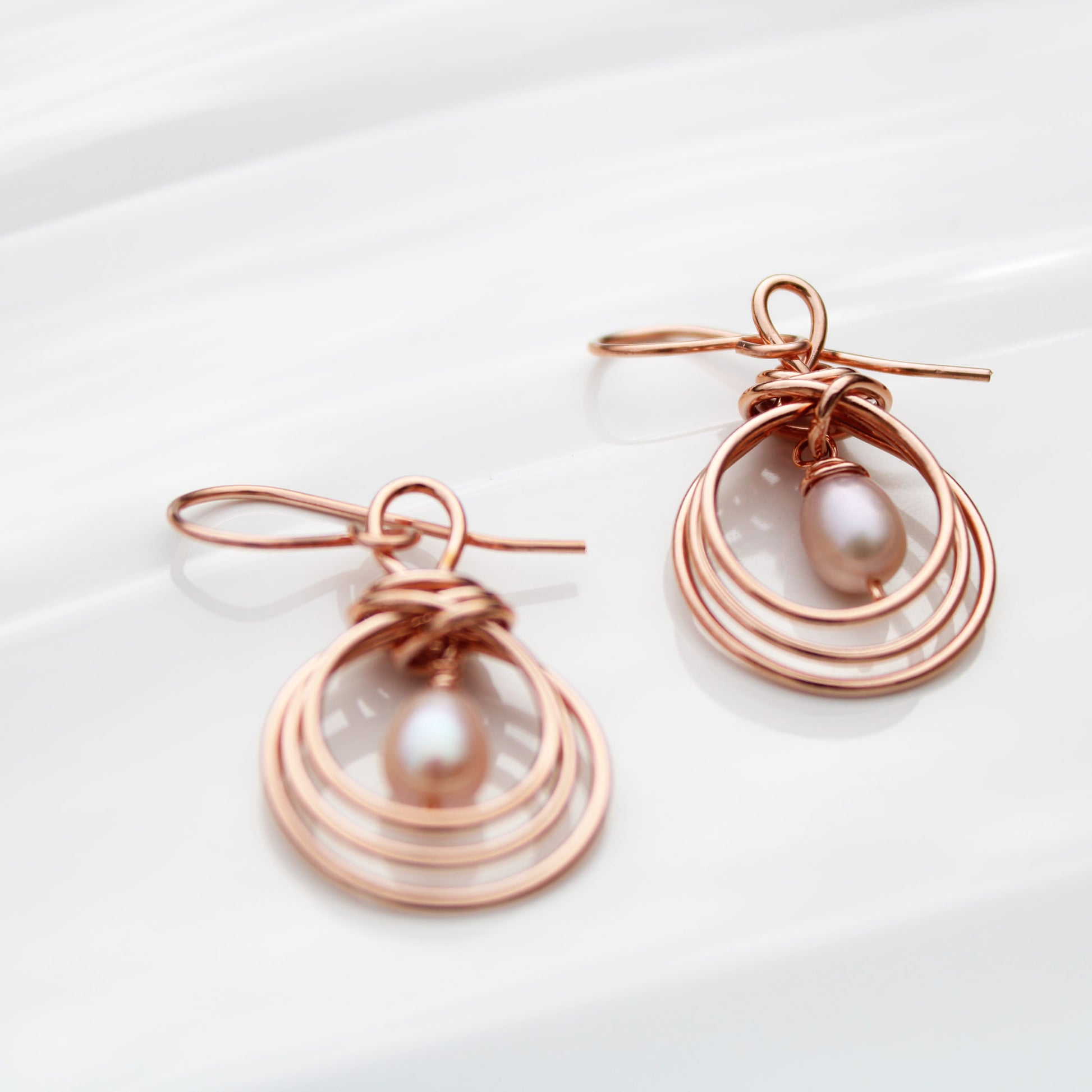 pipa knot wire wrapped copper earrings with pearl teardrop handmade USA carrie foscato design