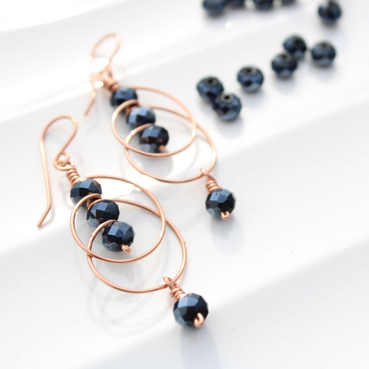 wire wrapped copper earrings with blue faceted spinel rondelle beads