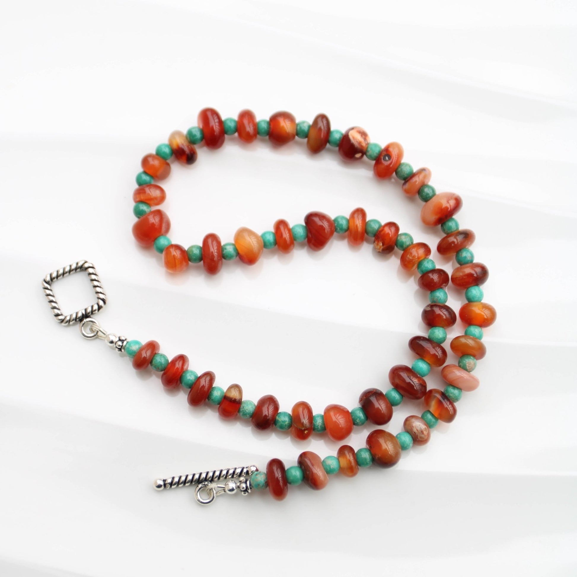 Botswana Red Agate Donut style beads accented with magnesite turquoise sterling toggle clasp handmade in virginia