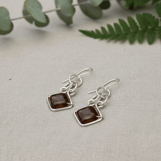 sterling silver chainmaille earrings with brown agate diamond-shaped gemstones on linen