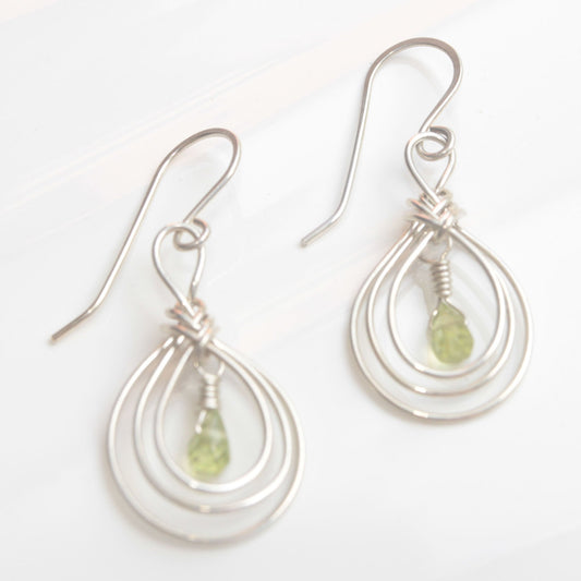 Handmade USA. sterling silver earrings with ancient Pipa Knot Design and peridot briolette gemstones. Carrie Foscato Design