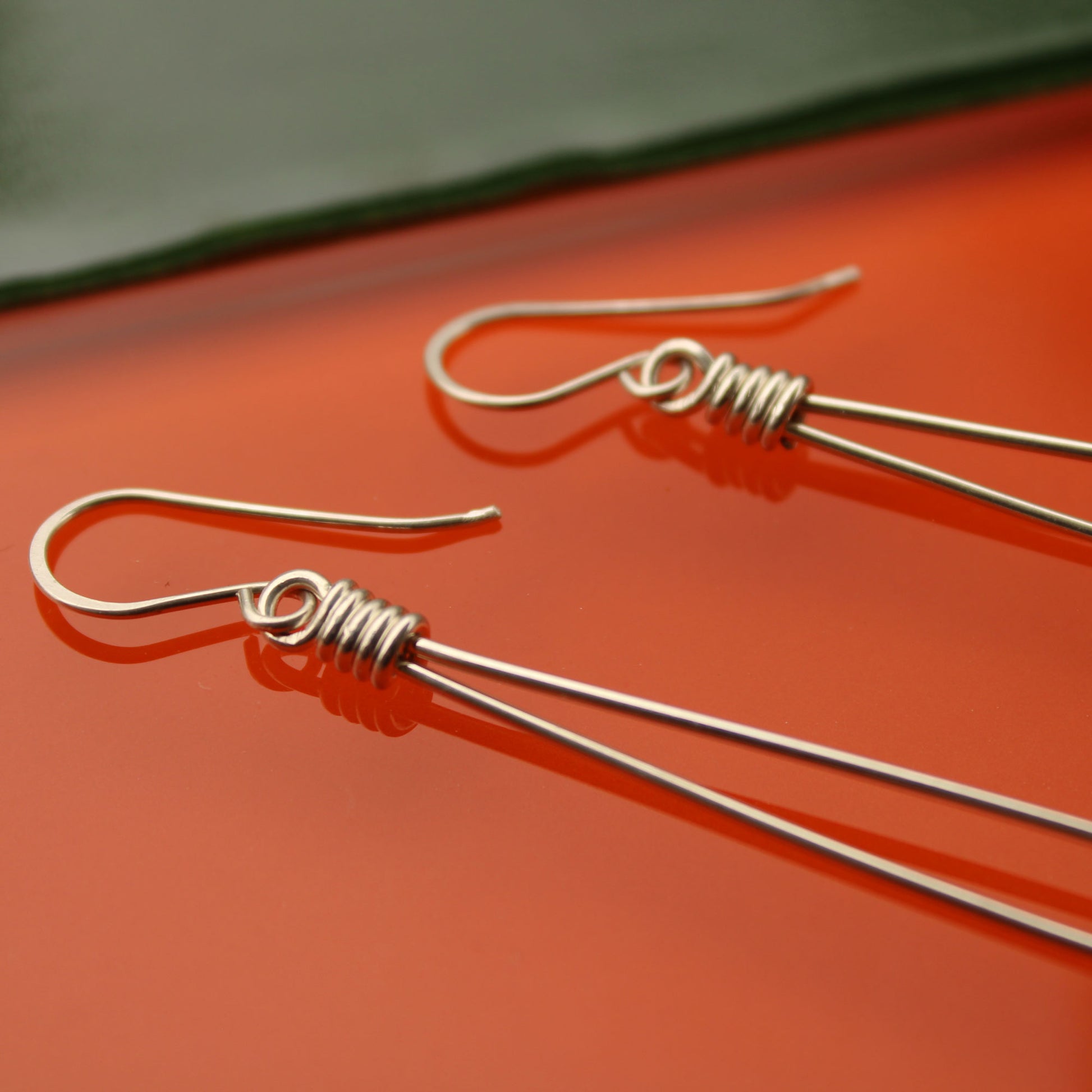 Sleek sterling silver long drop handmade earrings with rose quartz crystal beads carrie foscato design