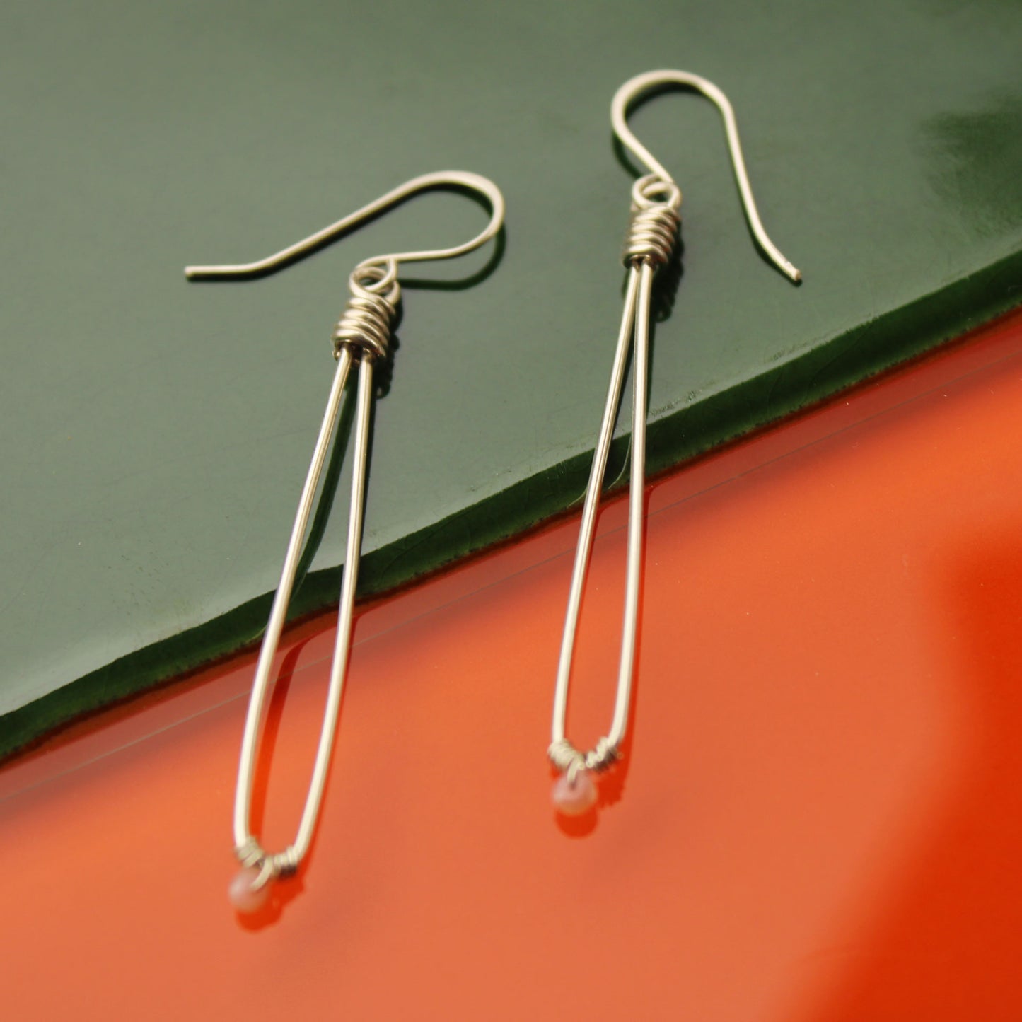 Sleek sterling silver long drop handmade earrings with rose quartz crystal beads carrie foscato design