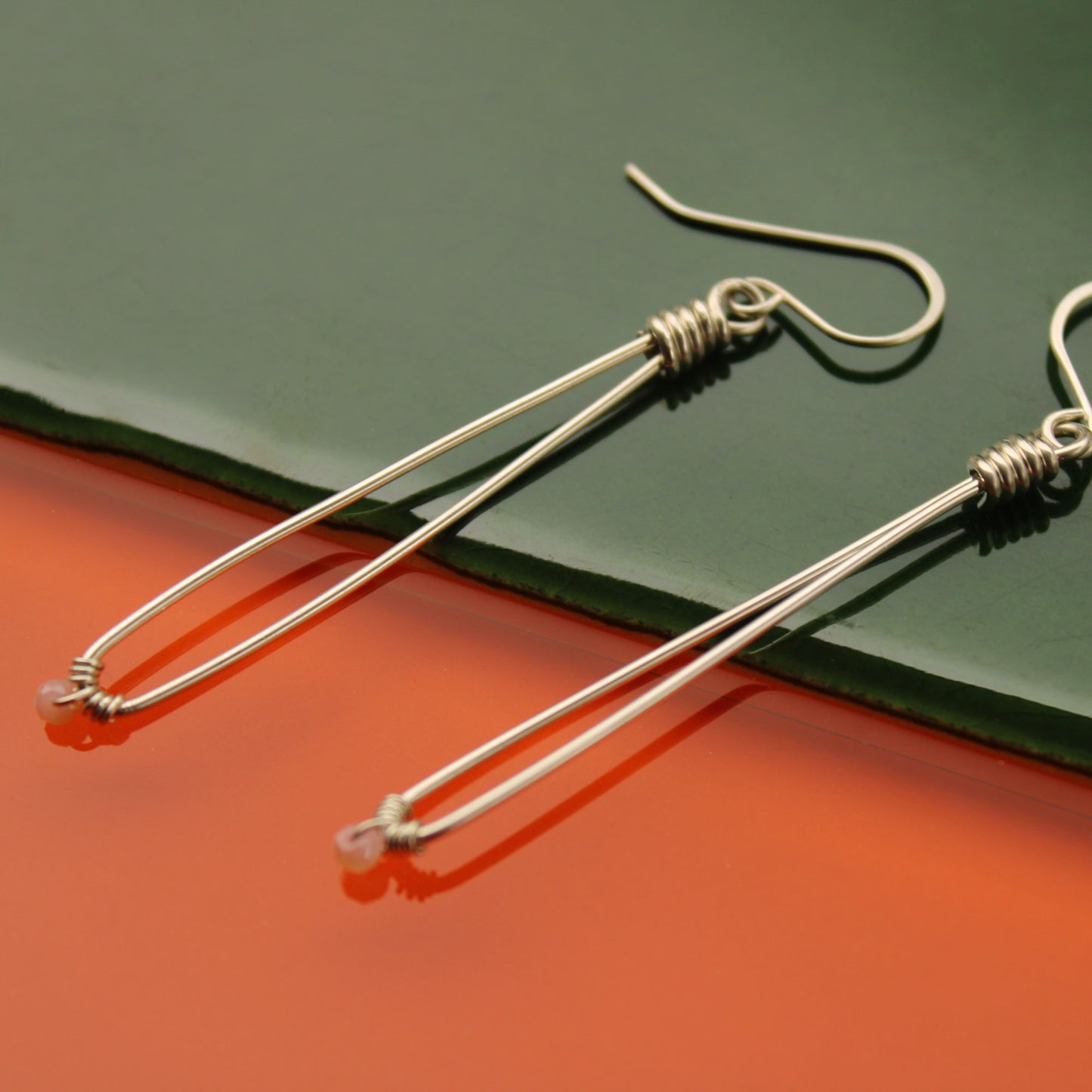 Sleek sterling silver long drop handmade earrings with rose quartz crystal beads carrie foscato design