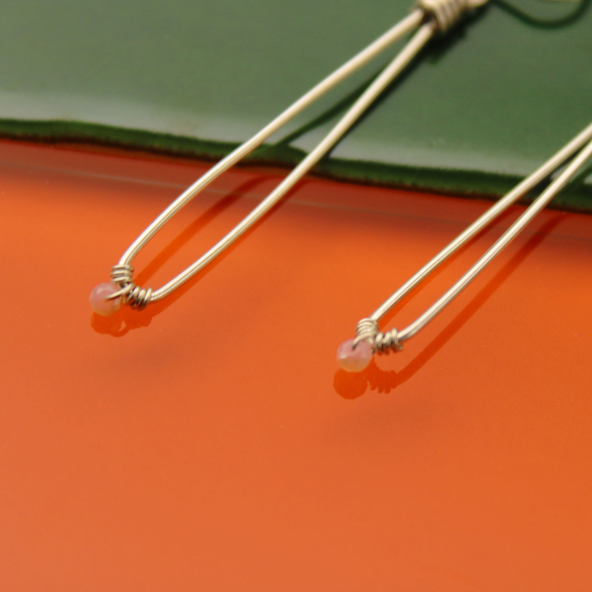 Sleek sterling silver long drop handmade earrings with rose quartz crystal beads carrie foscato design