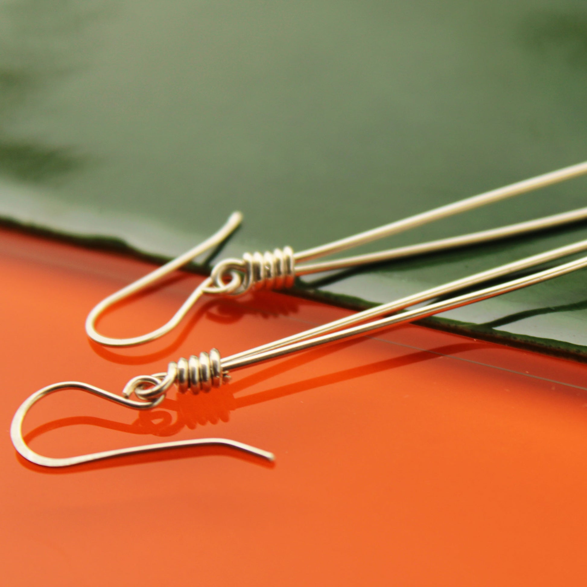 Sleek sterling silver long drop handmade earrings with rose quartz crystal beads carrie foscato design