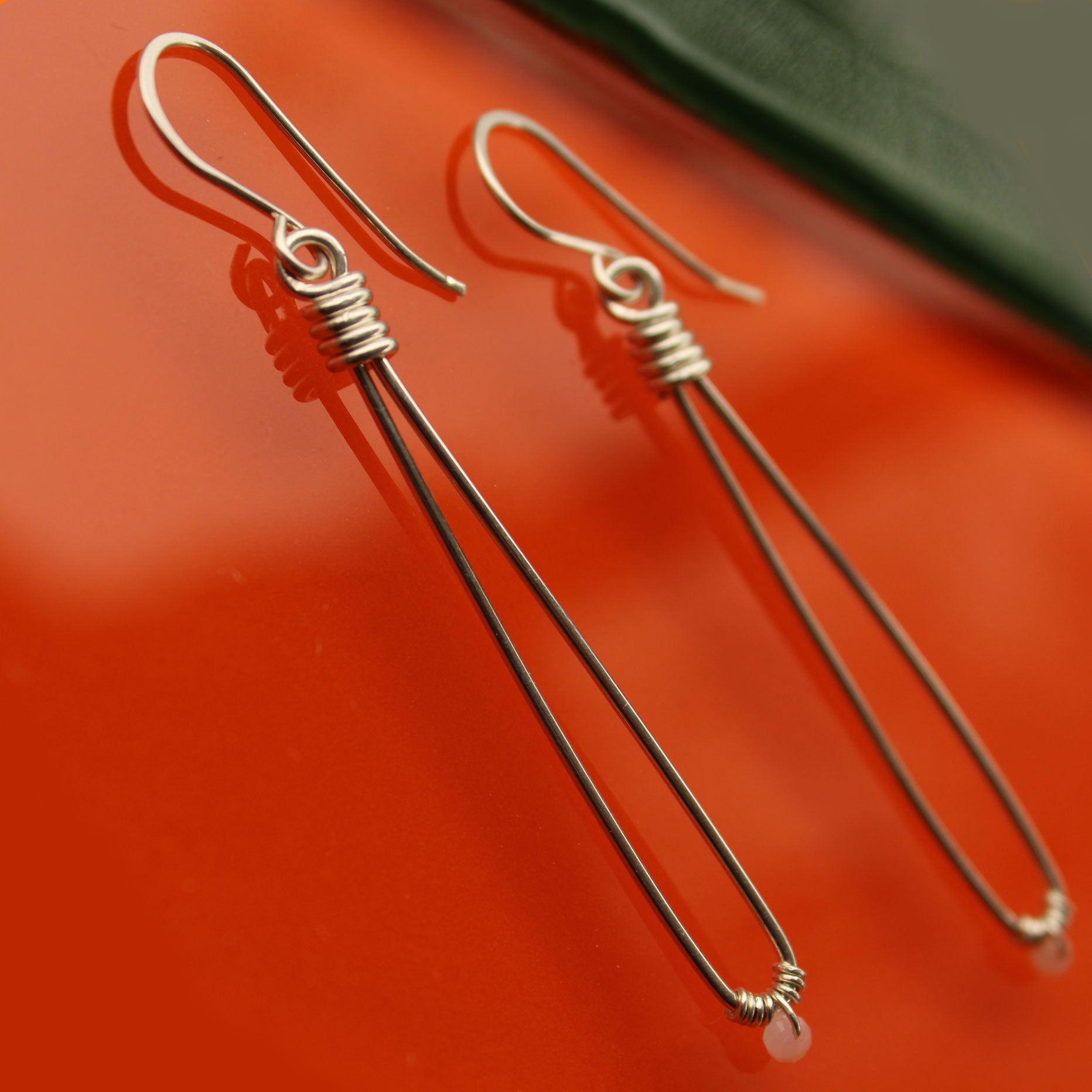 Sleek sterling silver long drop handmade earrings with rose quartz crystal beads carrie foscato design