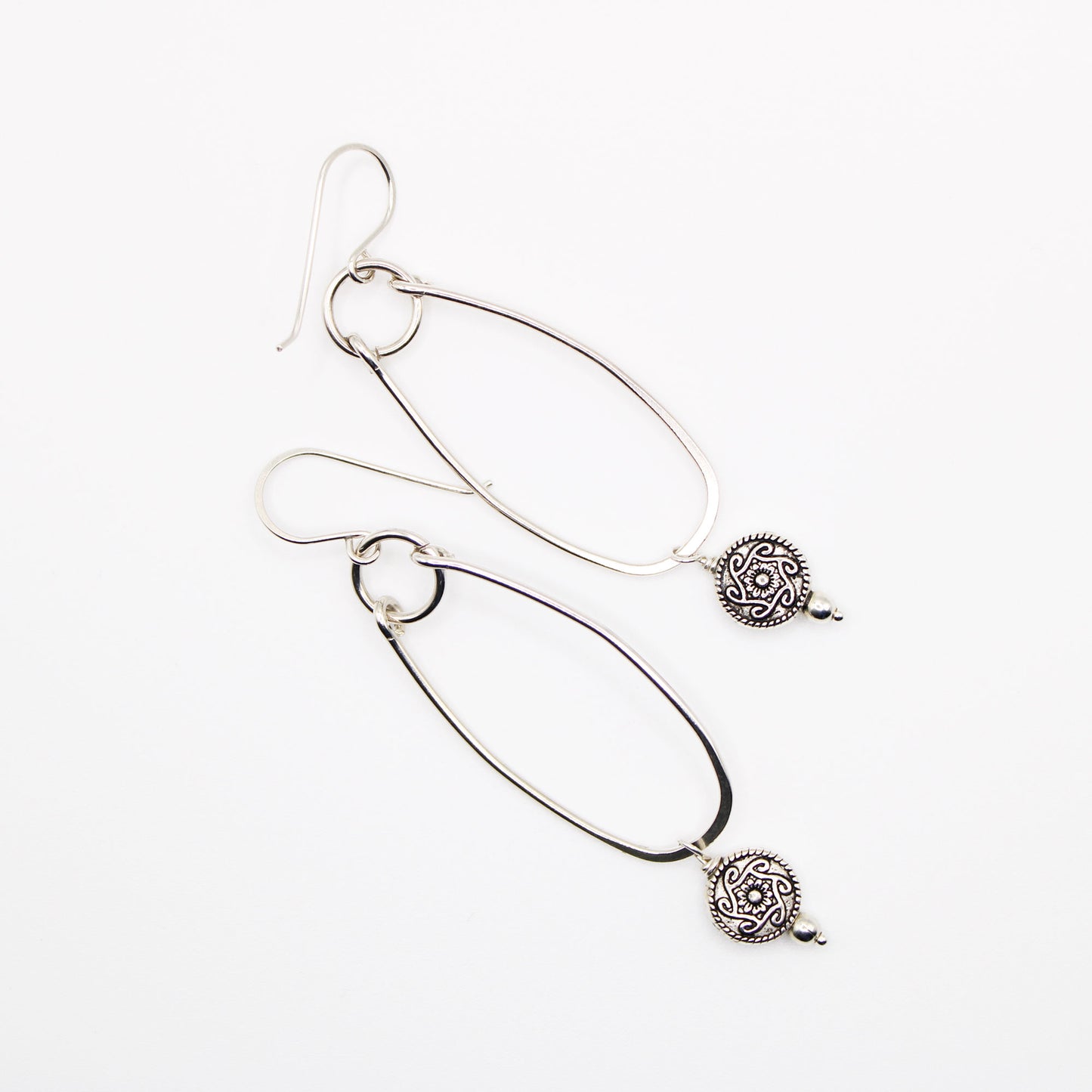 sterling silver oblong hoop earrings with silver medallion accent bead