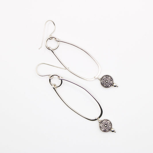 sterling silver oblong hoop earrings with silver medallion accent bead