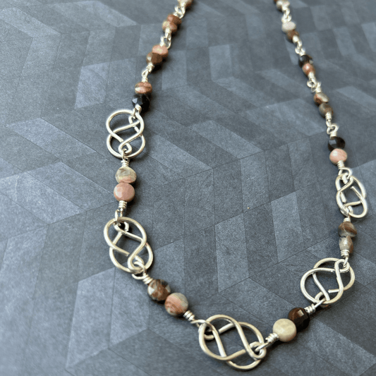 Handmade sterling silver wire wrapped necklace with petrified wood coin beads