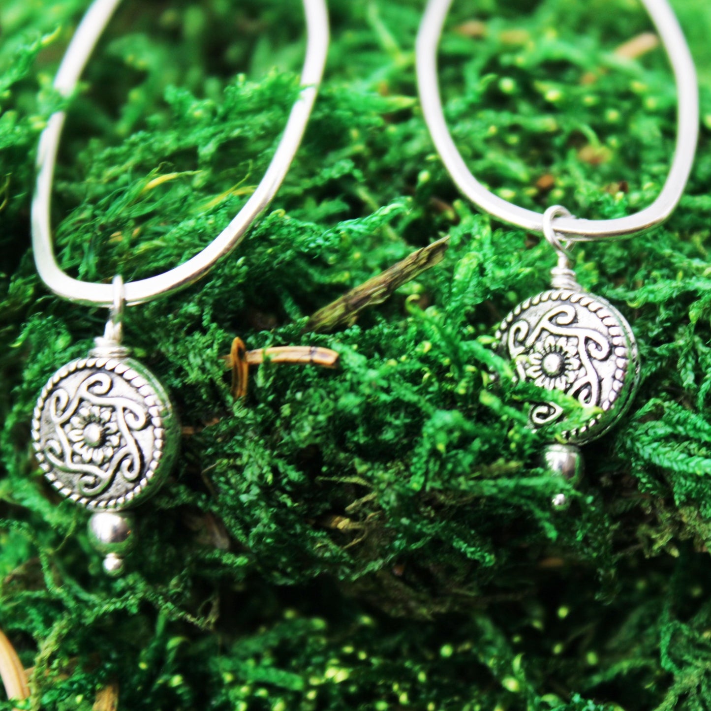 handmade sterling silver oblong earrings with silver medallion accent bead carrie foscato design USA