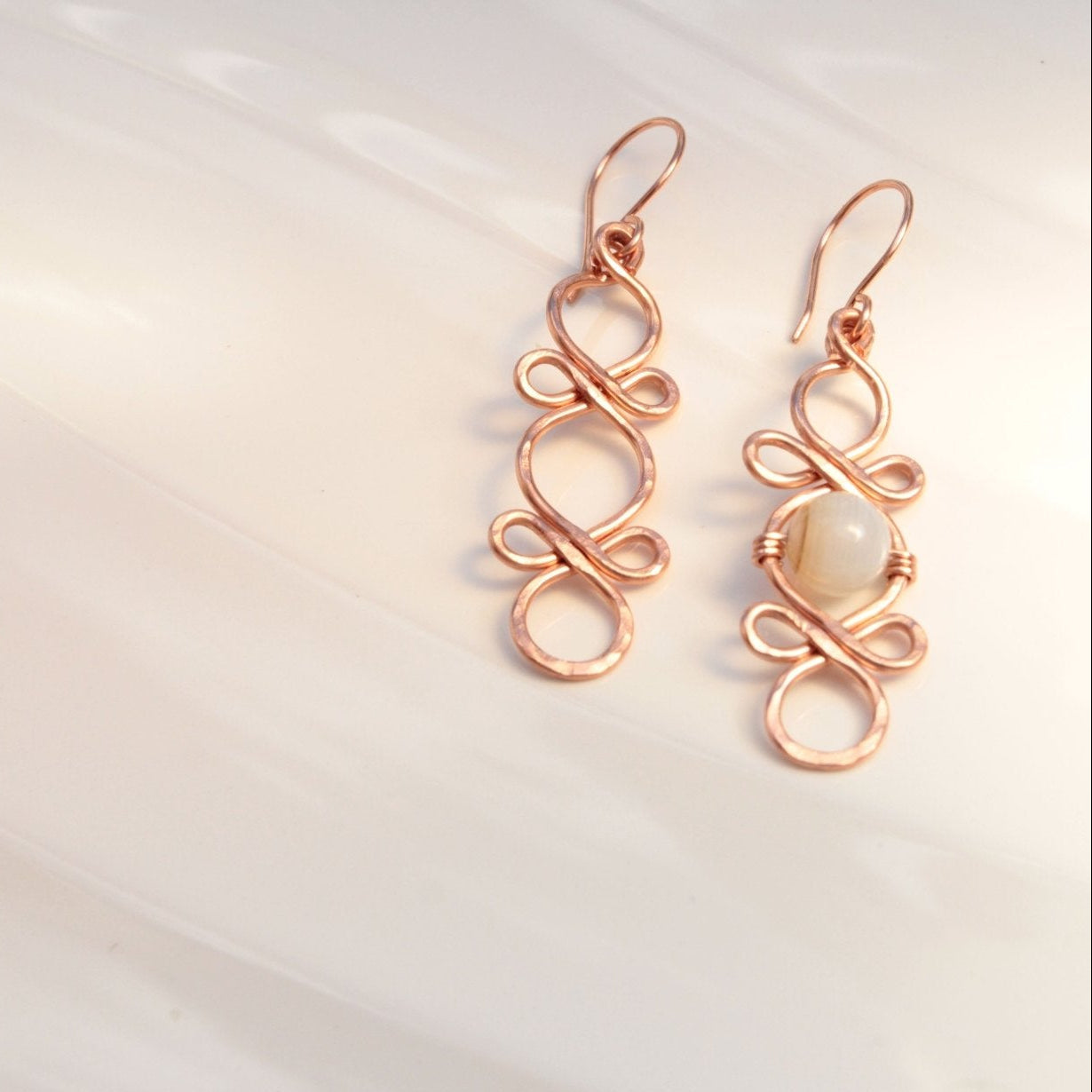 Triple Infinity Looped with custom accent bead handmade french ear wires carrie foscato design USA