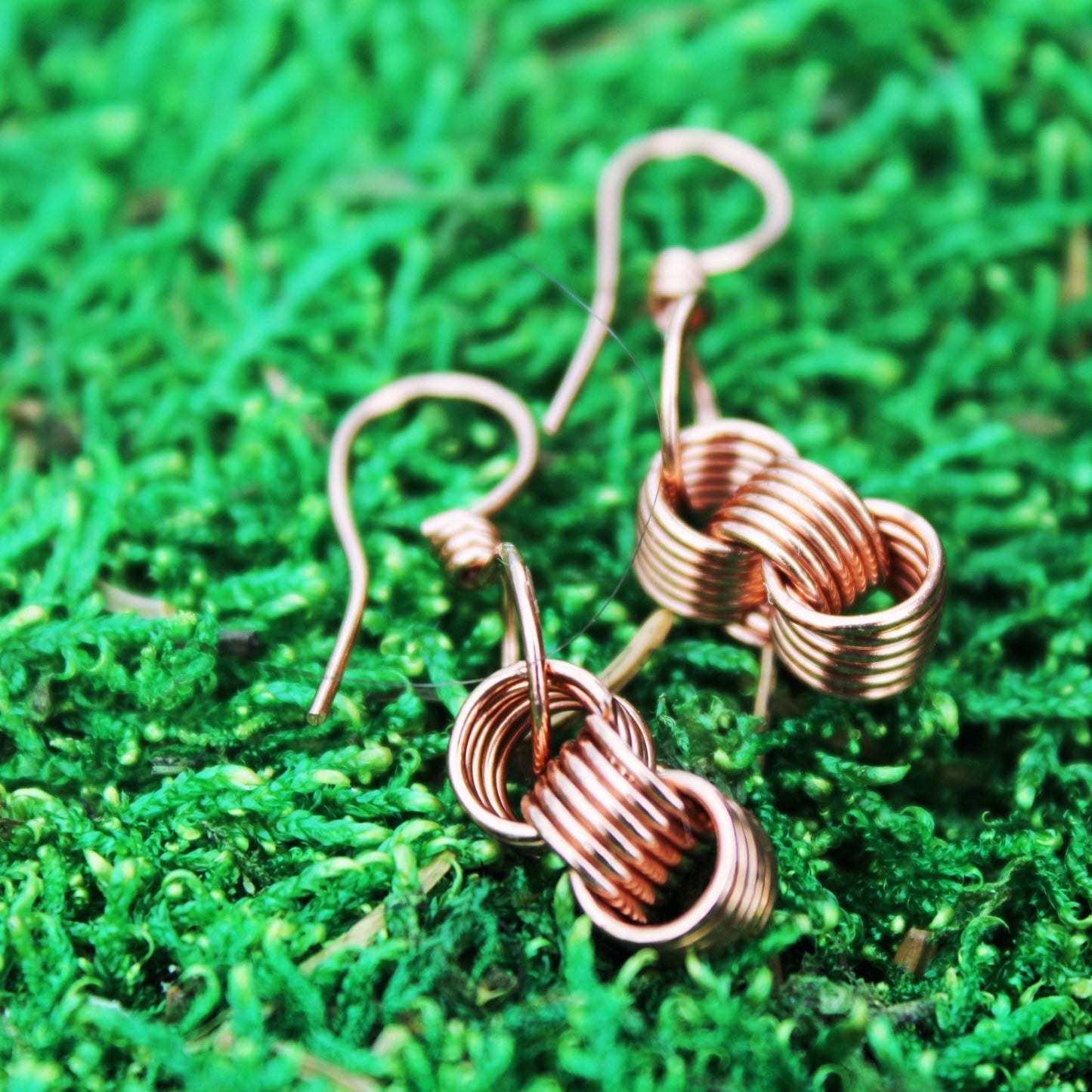 original design of triple coiled wire wrapped earrings handmade by carrie foscato design USA